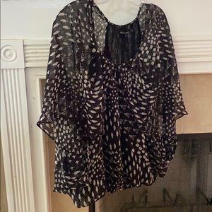 Black “flowy” sheer shirt with a white print
